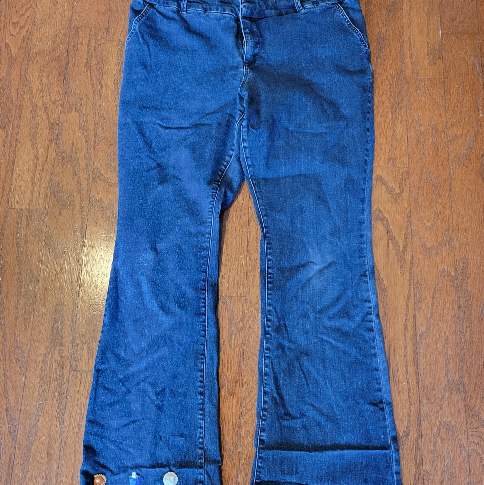 Torrid premium jeans with precious embroidery on back pockets and bottom hem.